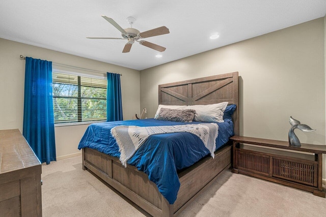 bedroom with light carpet and ceiling fan