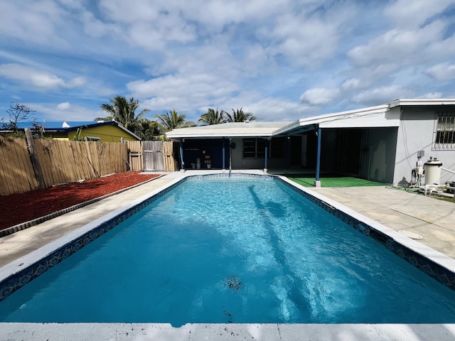 view of swimming pool with a patio