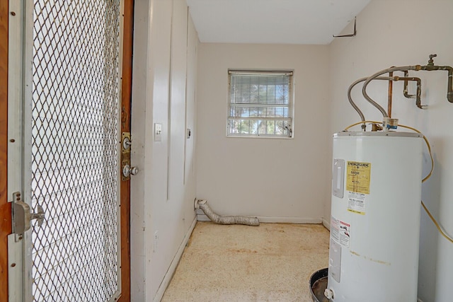 utility room featuring water heater