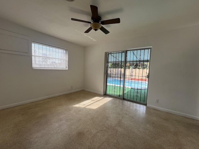 spare room with ceiling fan