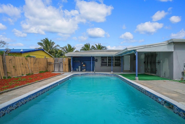 view of pool featuring a patio, fence, and a fenced in pool