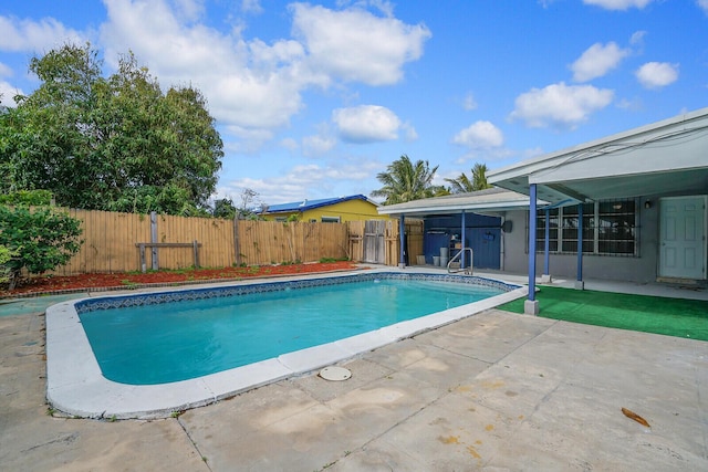 view of pool with a fenced in pool, a patio, and fence