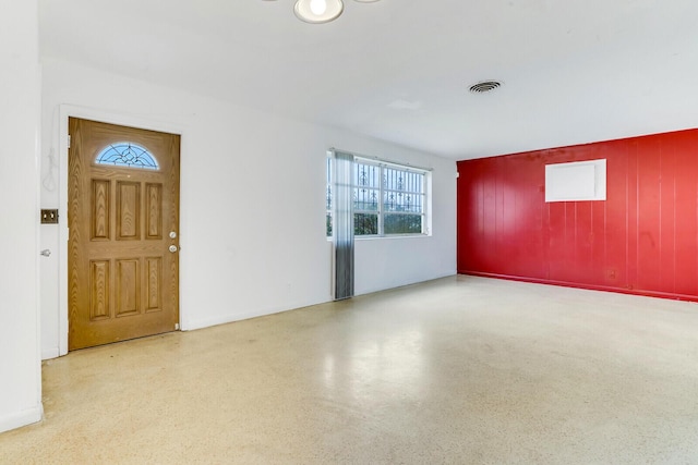 interior space featuring speckled floor and visible vents