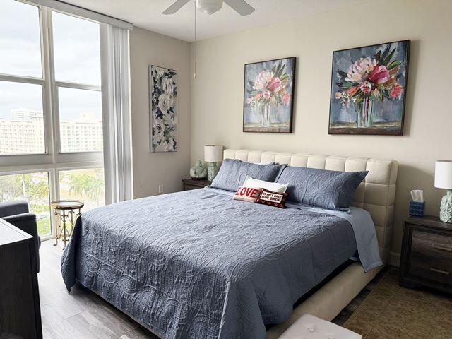 bedroom featuring hardwood / wood-style floors and ceiling fan