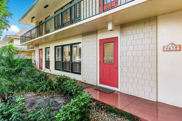 property entrance with a balcony