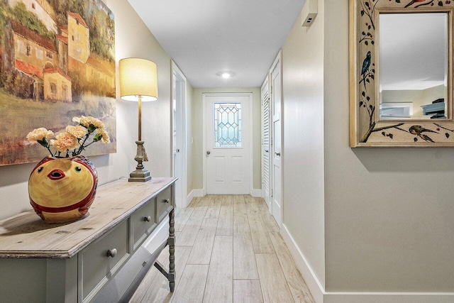 doorway with light hardwood / wood-style flooring