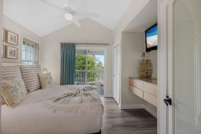 bedroom with ceiling fan, dark hardwood / wood-style flooring, lofted ceiling, and access to exterior