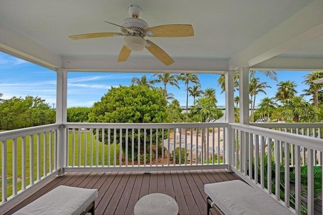 wooden terrace featuring ceiling fan