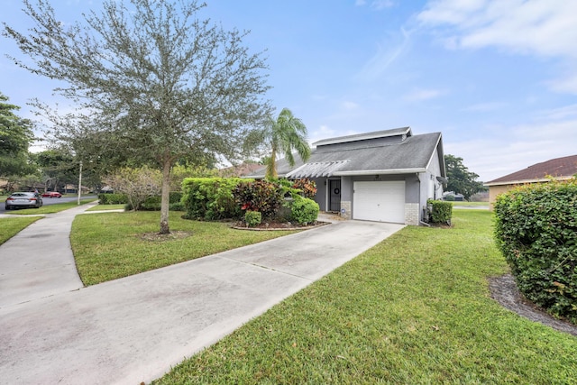 view of front of property with a front lawn and a garage