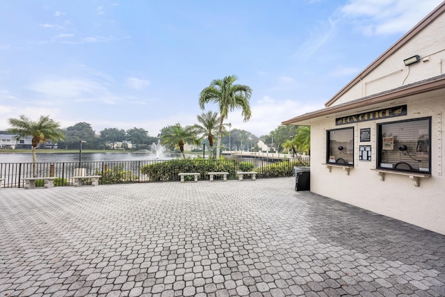 view of patio / terrace featuring a water view