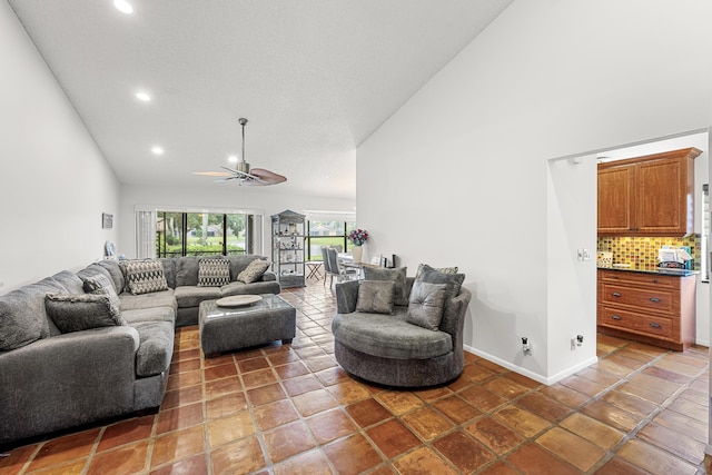 living room featuring tile patterned flooring, high vaulted ceiling, and ceiling fan