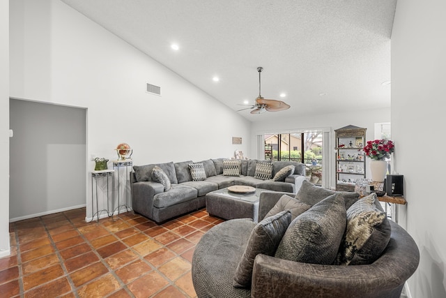 living room featuring tile patterned floors, ceiling fan, high vaulted ceiling, and a textured ceiling