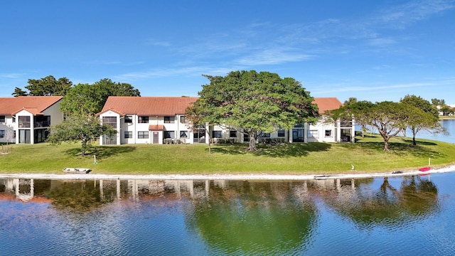 rear view of property with a water view