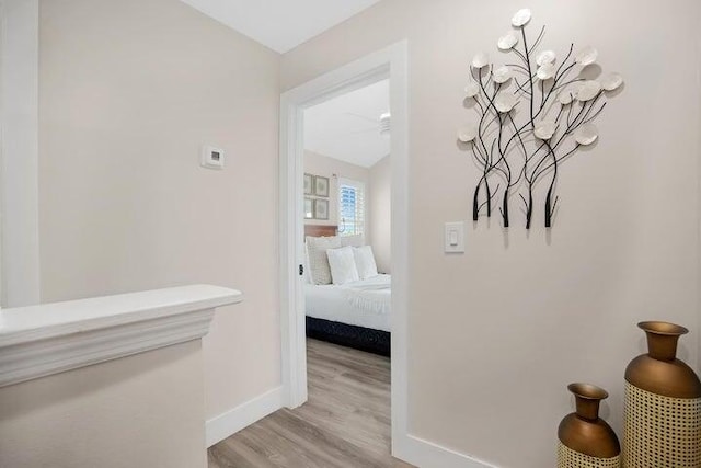 hallway with light hardwood / wood-style flooring