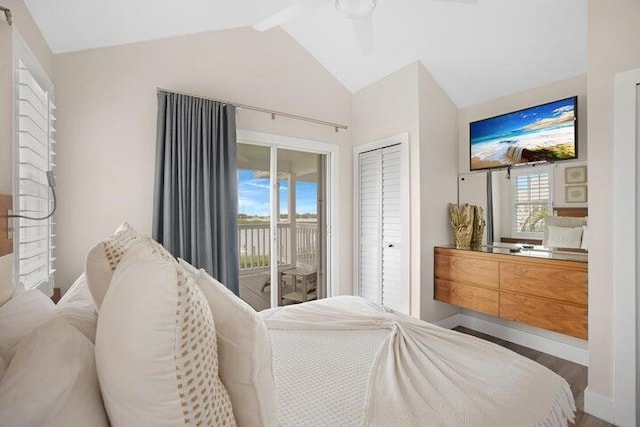 bedroom featuring ceiling fan, access to outside, lofted ceiling with beams, wood-type flooring, and a closet