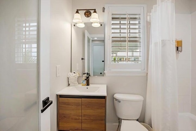 full bathroom featuring toilet, vanity, and shower / bath combination with curtain