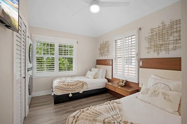 bedroom with ceiling fan and light hardwood / wood-style flooring