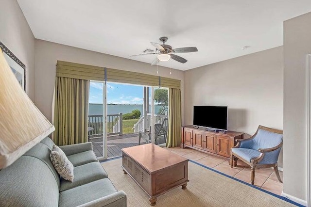 living room featuring ceiling fan and light tile patterned floors