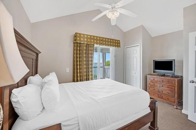 carpeted bedroom with ceiling fan, vaulted ceiling, a closet, and access to exterior