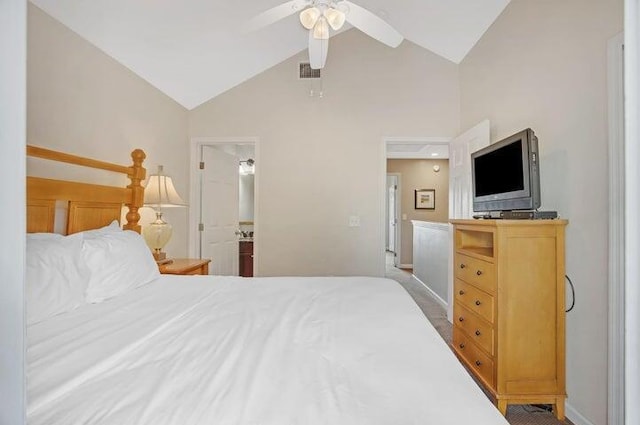 carpeted bedroom featuring ceiling fan and vaulted ceiling