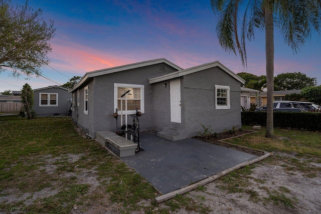 view of front of house with a yard