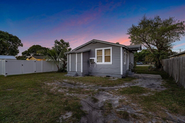 view of back house at dusk