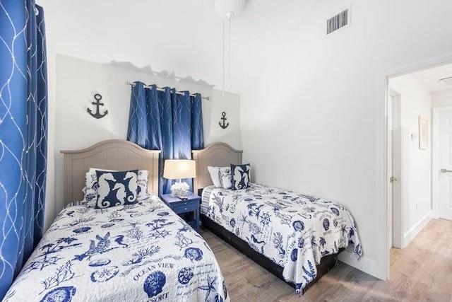 bedroom featuring dark hardwood / wood-style flooring