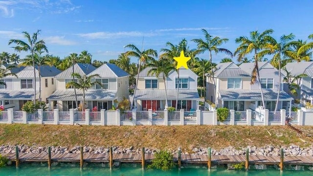 rear view of property featuring a water view