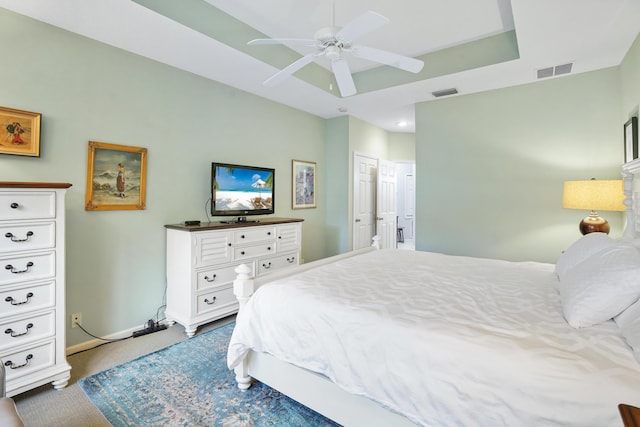 carpeted bedroom with ceiling fan and a closet