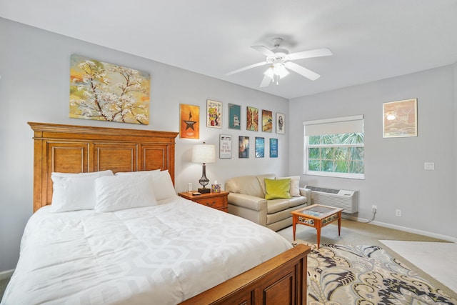 carpeted bedroom with ceiling fan and a wall mounted AC