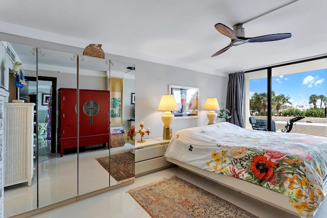 bedroom featuring ceiling fan and a closet