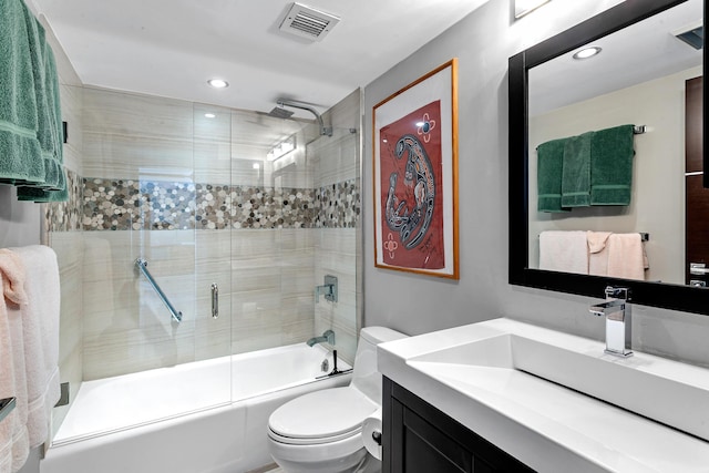 full bathroom featuring vanity, toilet, and enclosed tub / shower combo