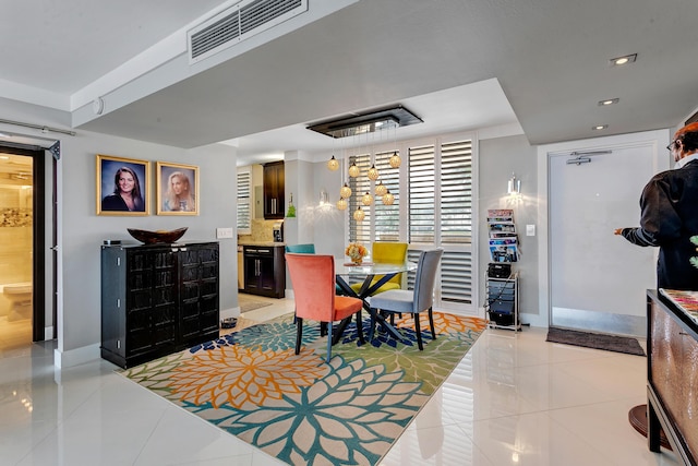 dining space with light tile patterned floors