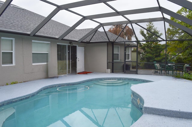 view of pool featuring a lanai