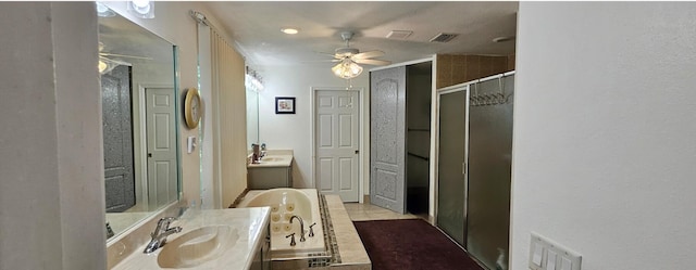 bathroom with plus walk in shower, vanity, and tile patterned floors