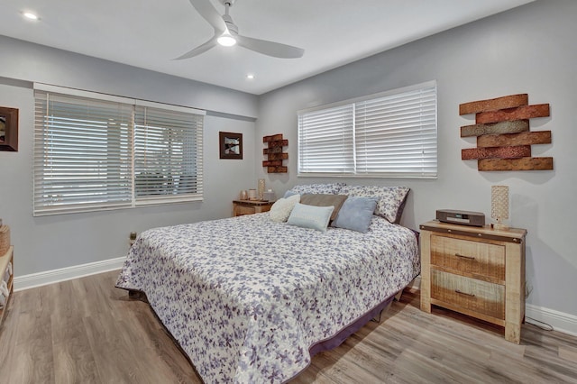 bedroom featuring ceiling fan and wood-type flooring