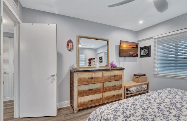 bedroom featuring ceiling fan and light hardwood / wood-style floors