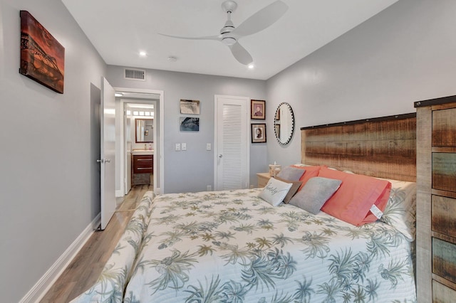 bedroom featuring connected bathroom, ceiling fan, and light hardwood / wood-style floors