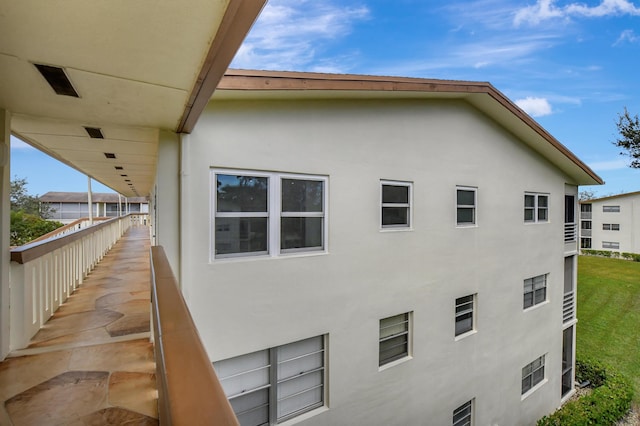 view of property exterior with a balcony