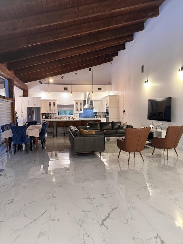 interior space featuring high vaulted ceiling, beamed ceiling, wooden ceiling, and visible vents