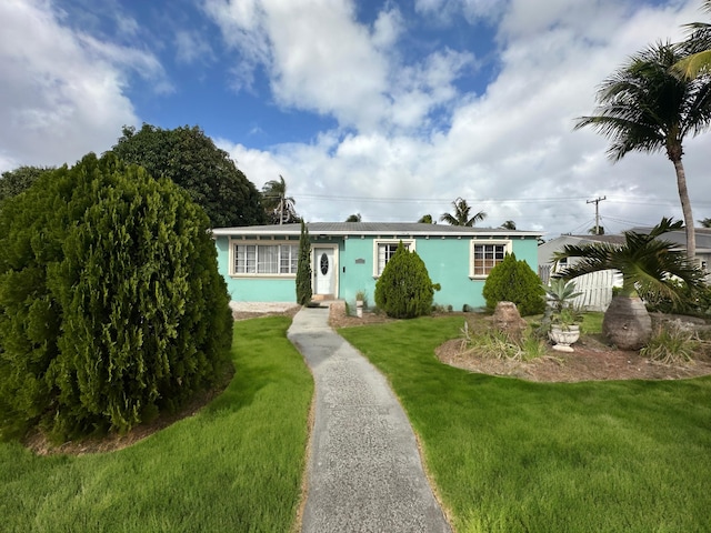 ranch-style home with a front yard