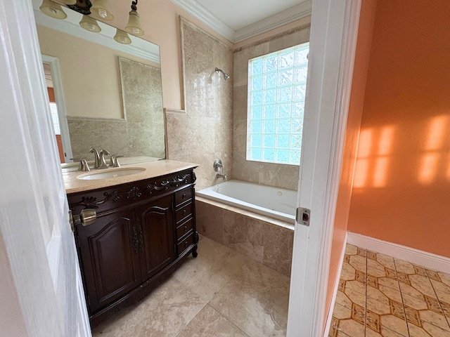 bathroom featuring ornamental molding, tiled shower / bath, and vanity