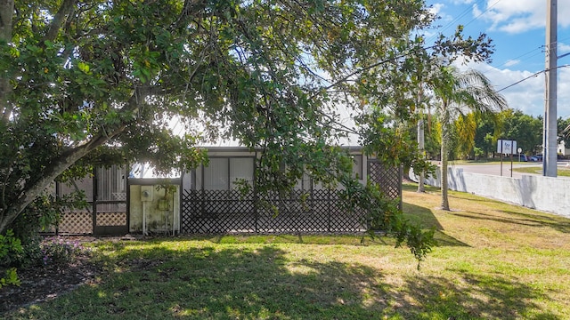 back of house featuring a yard