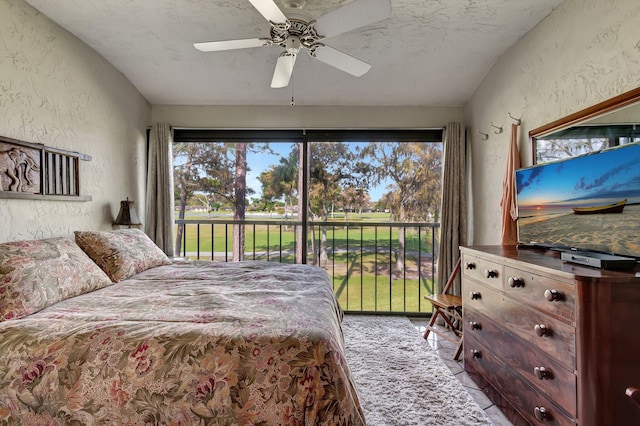 bedroom with a textured ceiling and ceiling fan