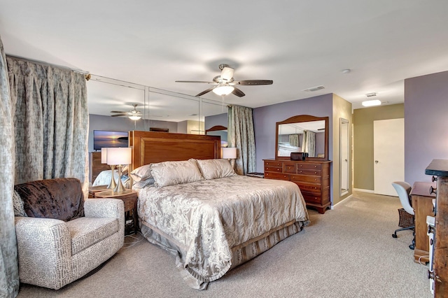 carpeted bedroom with ceiling fan