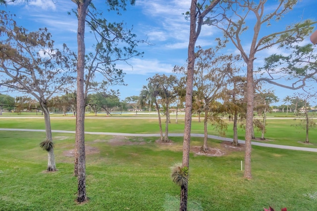 view of home's community featuring a lawn