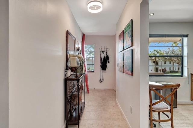 hallway featuring light tile patterned flooring