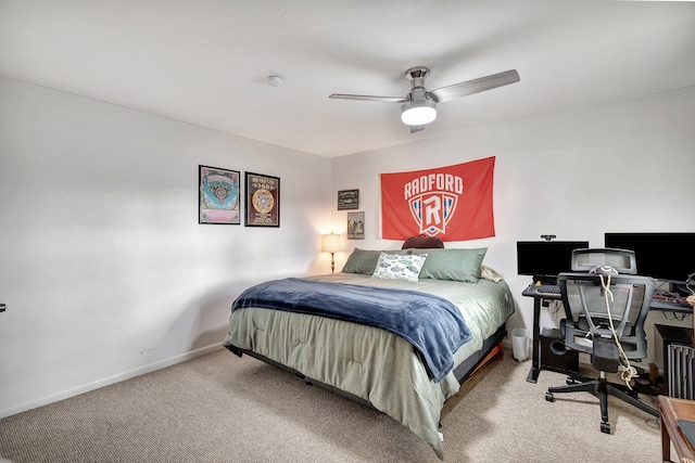 bedroom with ceiling fan and light carpet