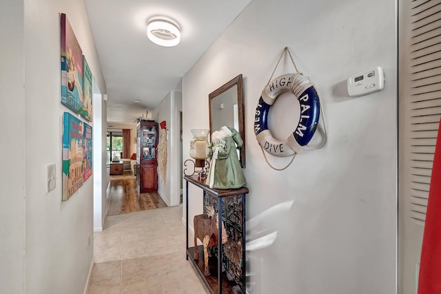 hallway with light hardwood / wood-style flooring