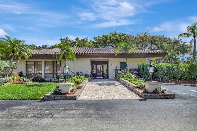 mediterranean / spanish house with french doors